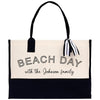 a black and white beach bag with the words beach day with the johnson family