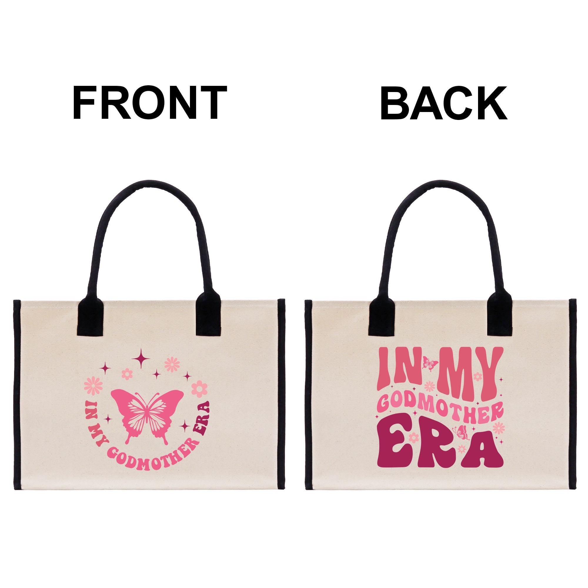 two bags with the words i&#39;m my godmother era printed on them