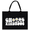 a black tote bag with a flower on it