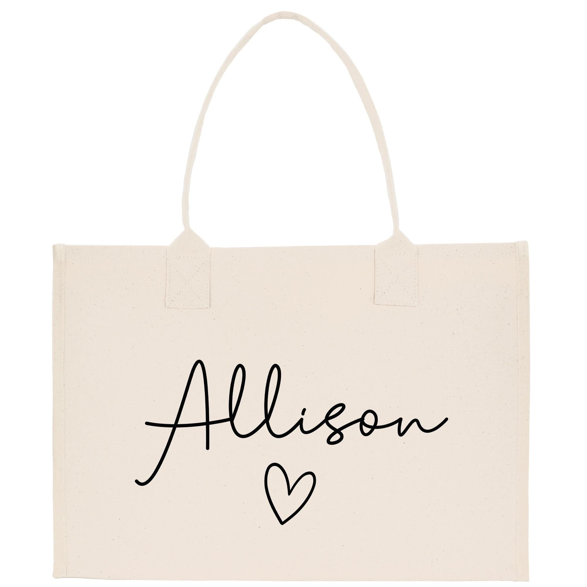 a white bag with a heart and name on it