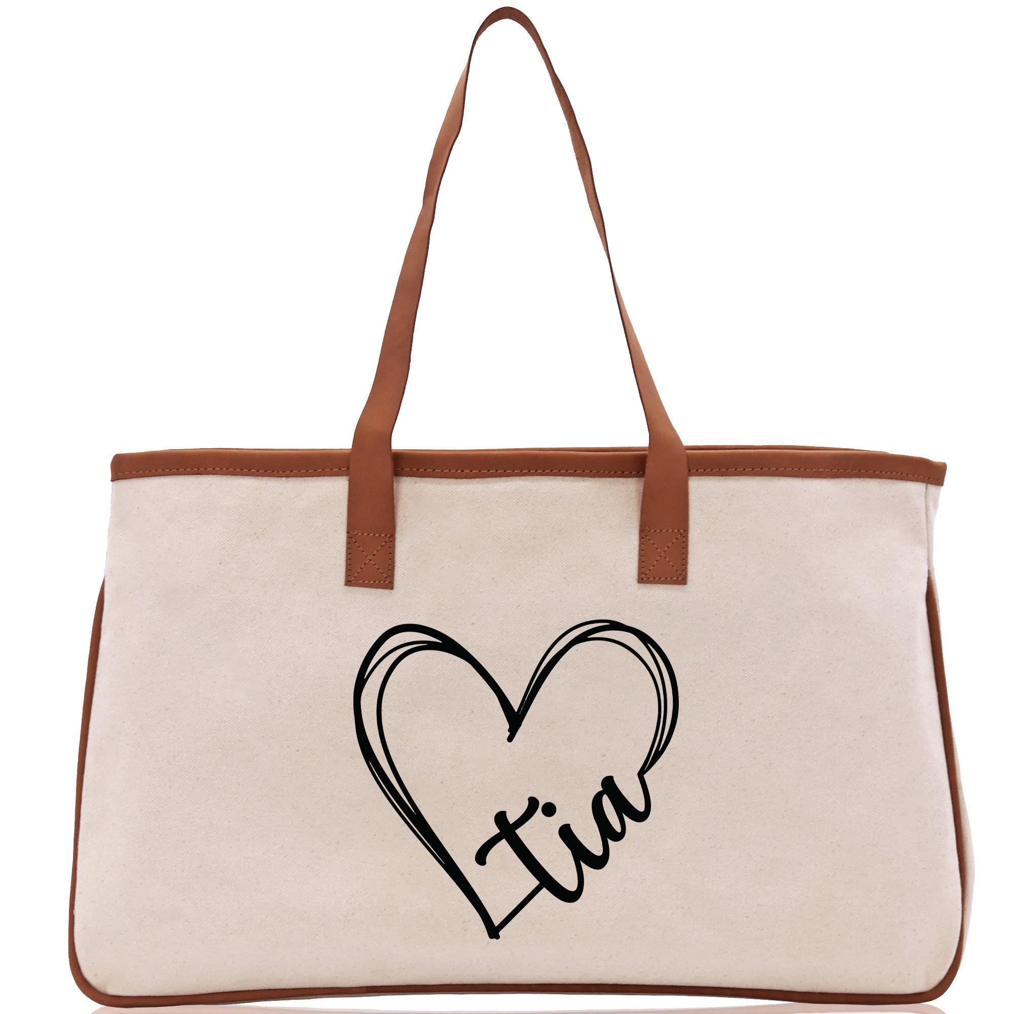 a canvas bag with a heart and initials on it