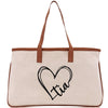 a canvas bag with a heart and initials on it