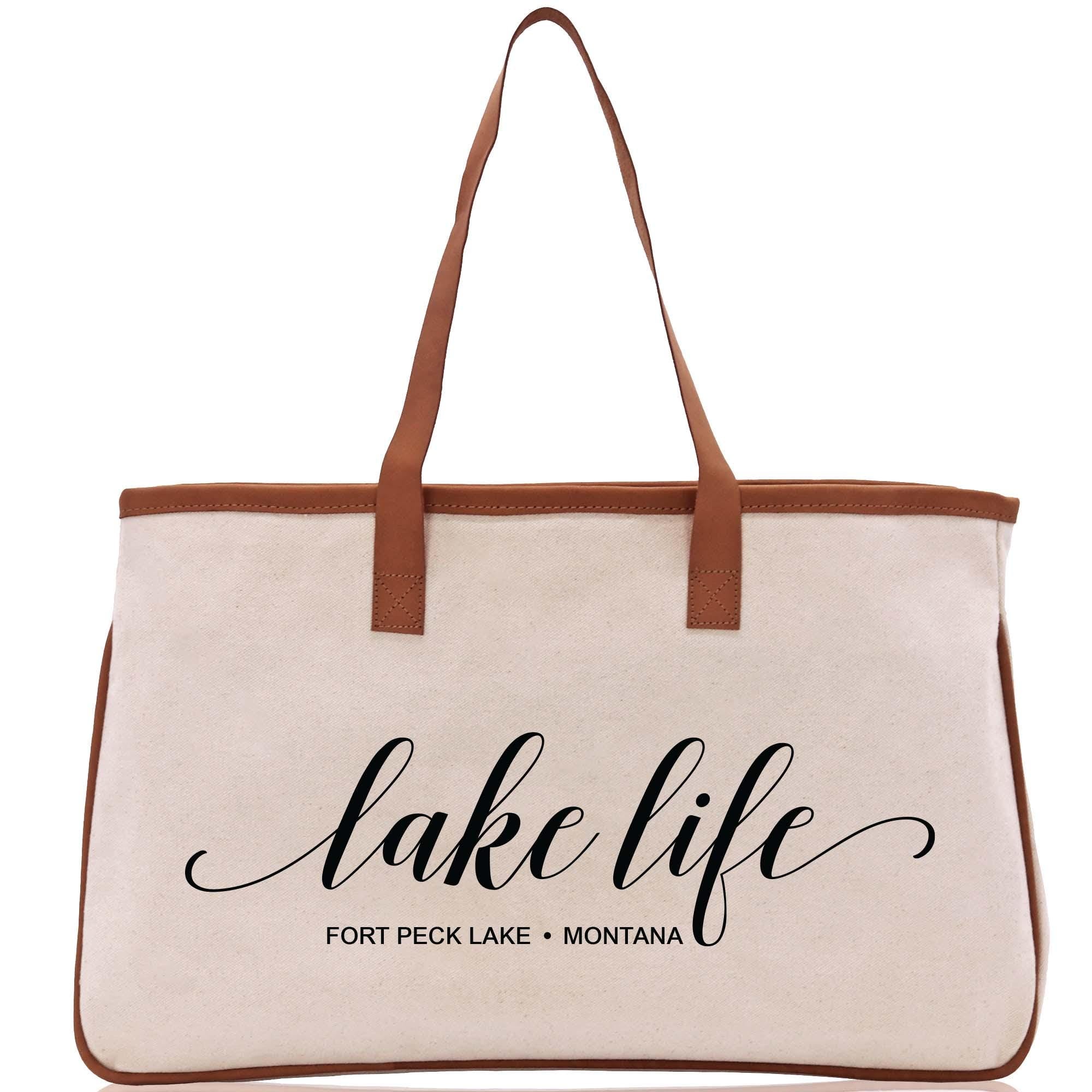 a white bag with a brown handle and the words lake life on it
