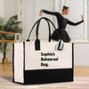 a woman in a black dress is dancing with a black and white bag