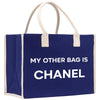 a blue bag with a white handle that says, my other bag is chanel