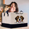 a woman kissing a dog in front of a bag