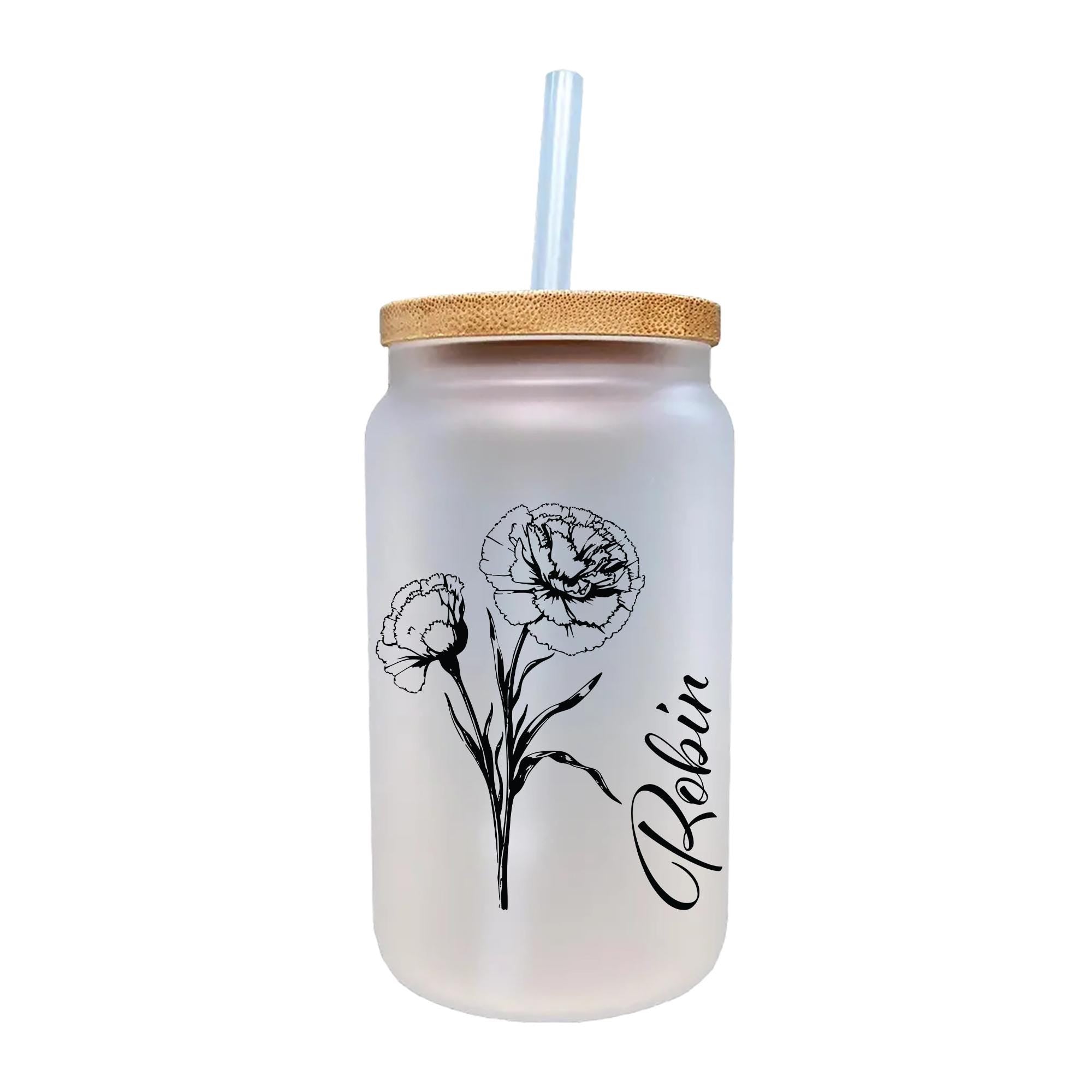 a glass jar with a straw in it