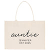 A beige canvas tote bag with the text "auntie" and "JENIFER EST 2025" printed on it.