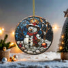A stained glass ornament depicting a snowman is hanging in the center of the image, surrounded by Christmas lights and greenery.