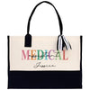 a white and black medical bag with a black handle