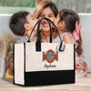 a woman holding a child and kissing a bag