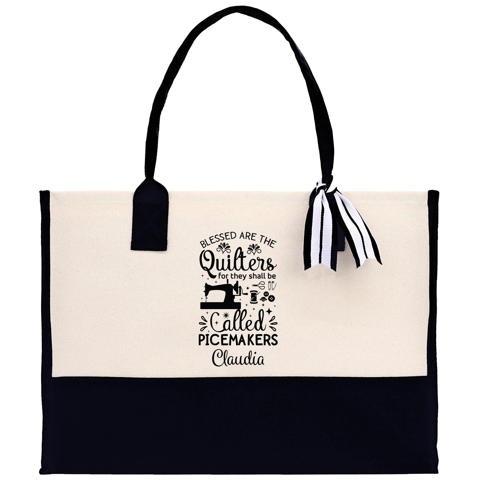 a black and white tote bag with a bow