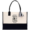 a black and white tote bag with a bow