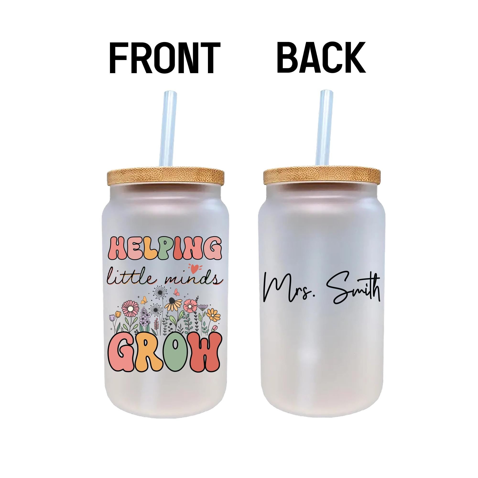 a couple of water bottles with straws in them