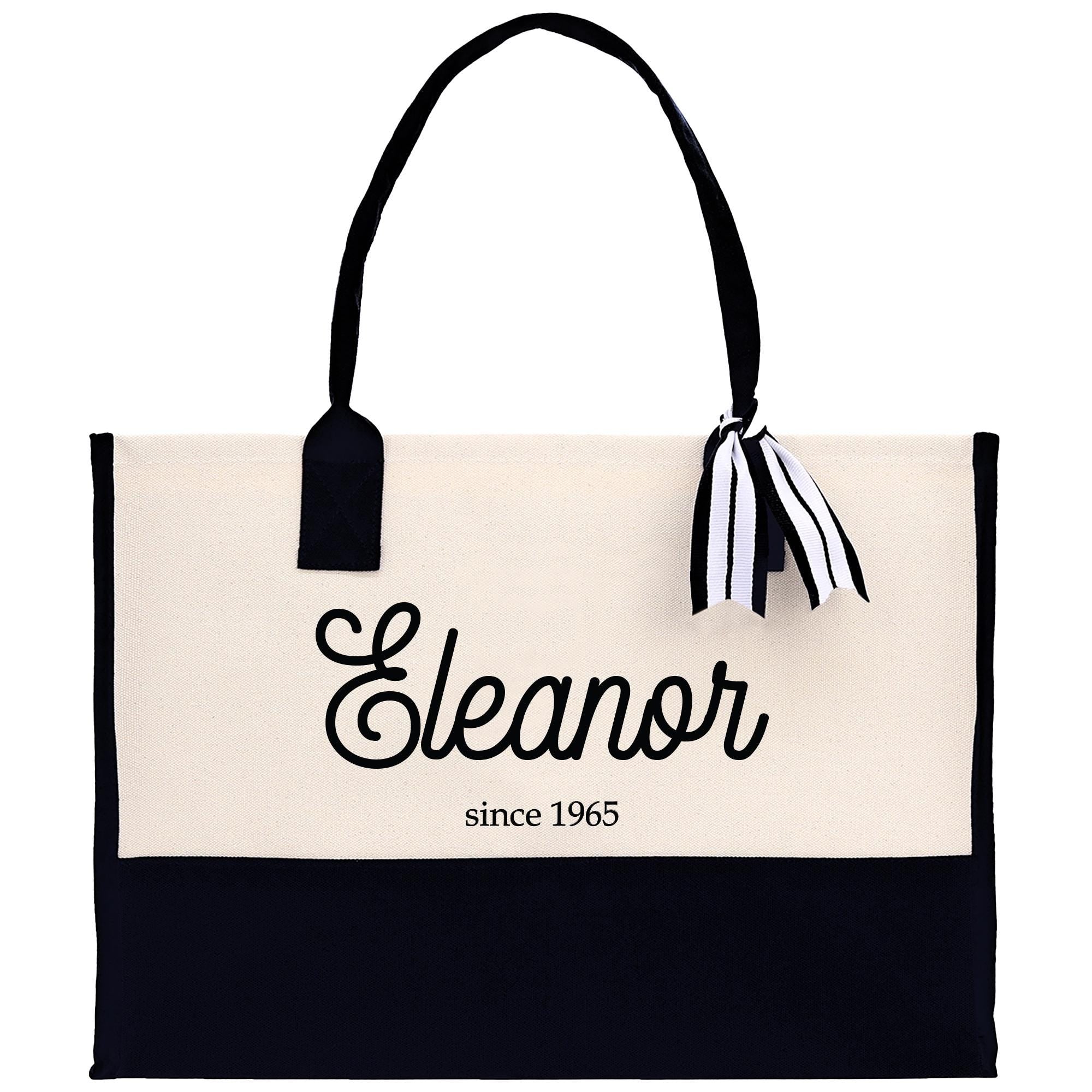 a black and white bag with a black and white ribbon