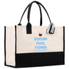 a black and white shopping bag with a striped handle