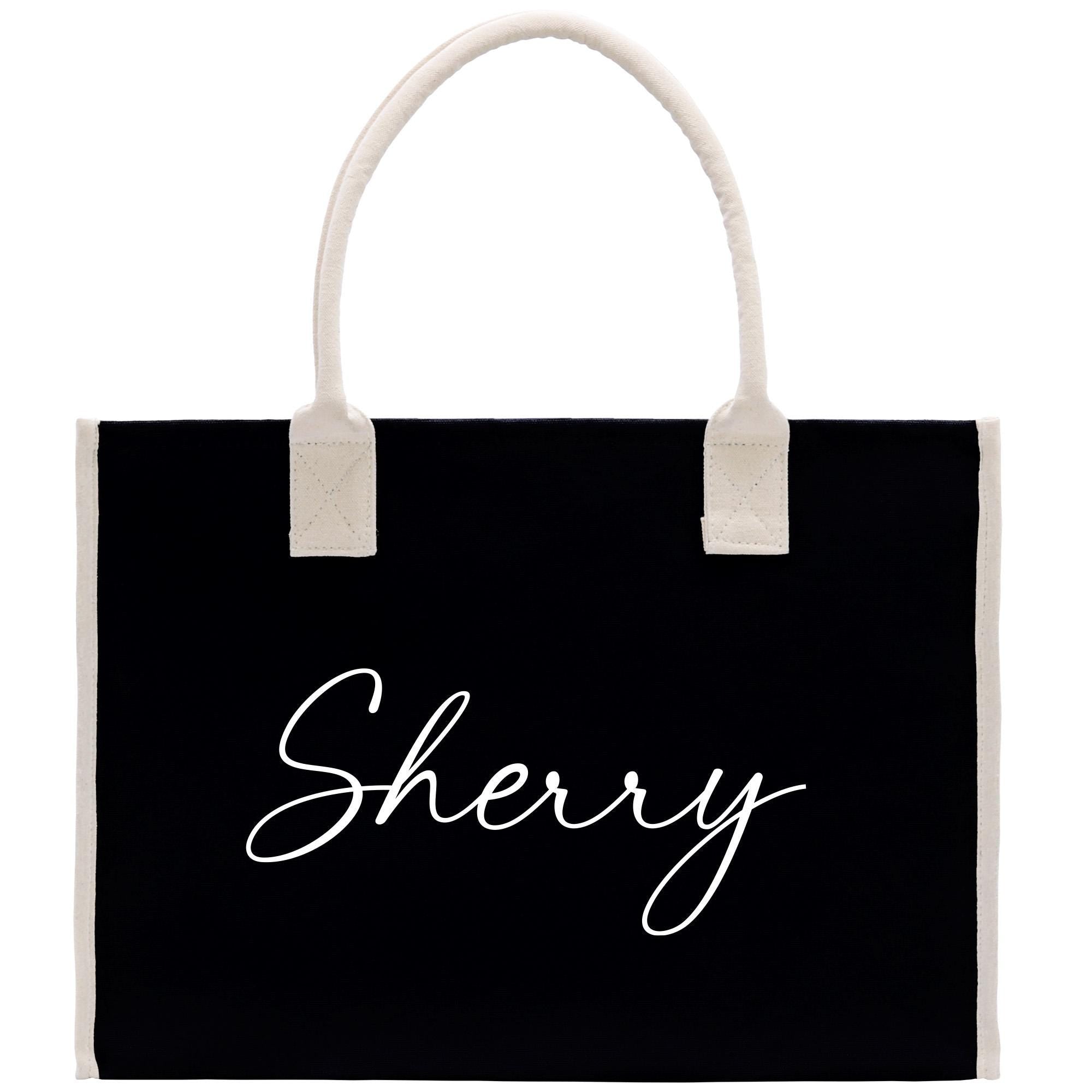 a black shopping bag with the word sheryl printed on it