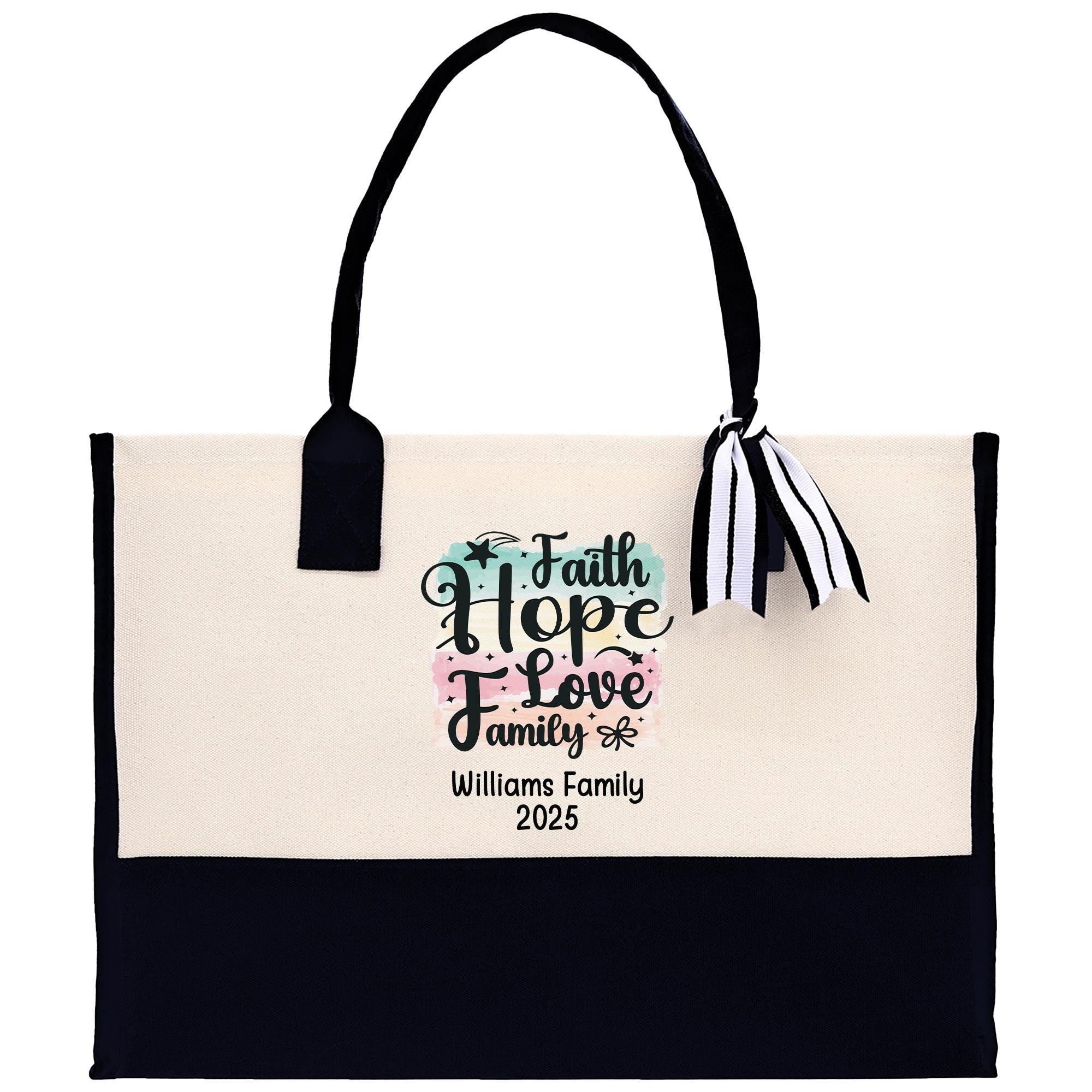 A beige tote bag with a black handle and a black and white striped ribbon tied around it. The bag has a printed message on it that says &quot;Faith Hope Love Family&quot; and &quot;Williams Family 2020&quot;.