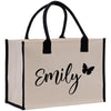 a white bag with a black handle and a butterfly on it