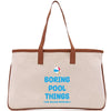 a canvas bag with a brown leather handle