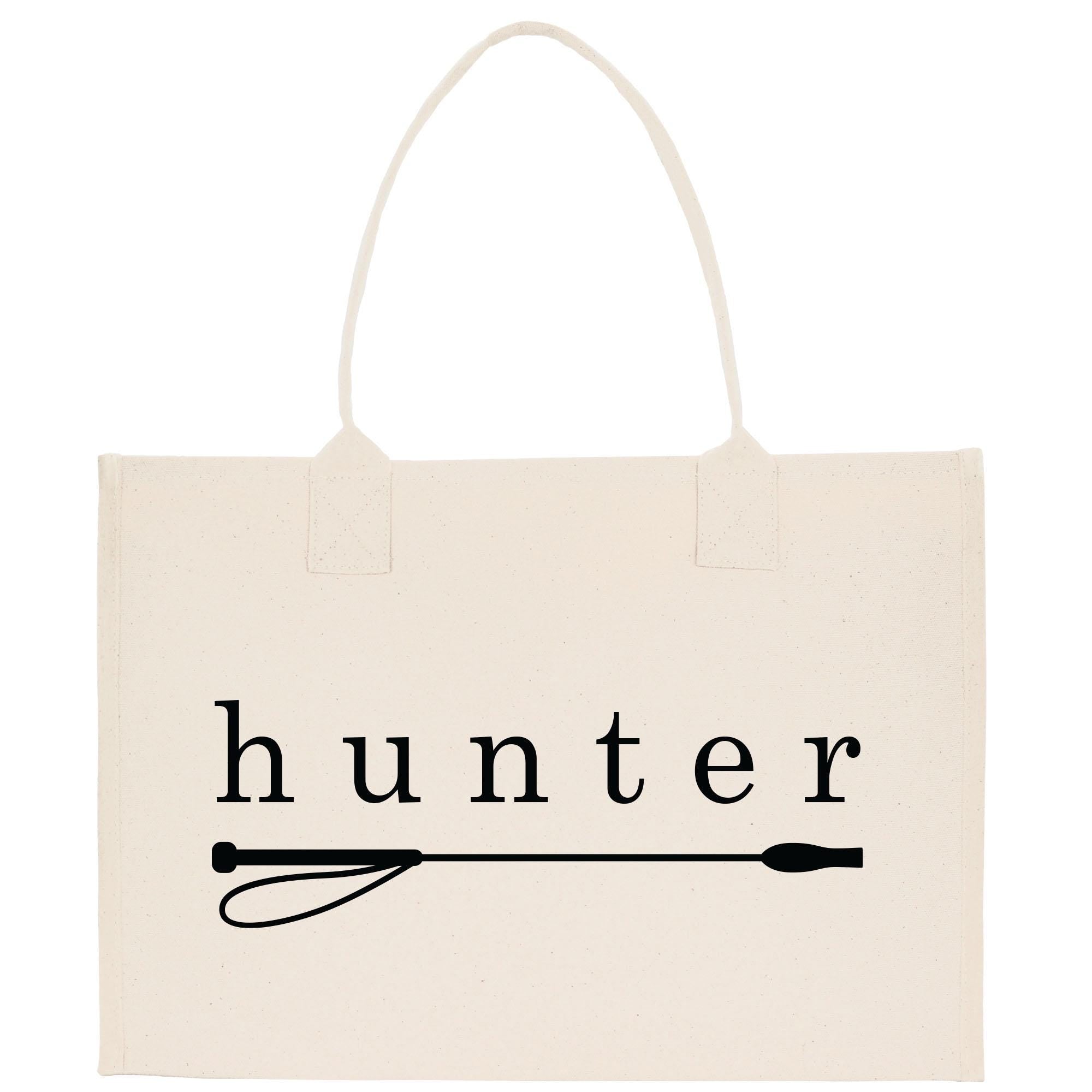 A beige canvas tote bag with the word &quot;hunter&quot; printed on it in black text.