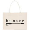A beige canvas tote bag with the word "hunter" printed on it in black text.