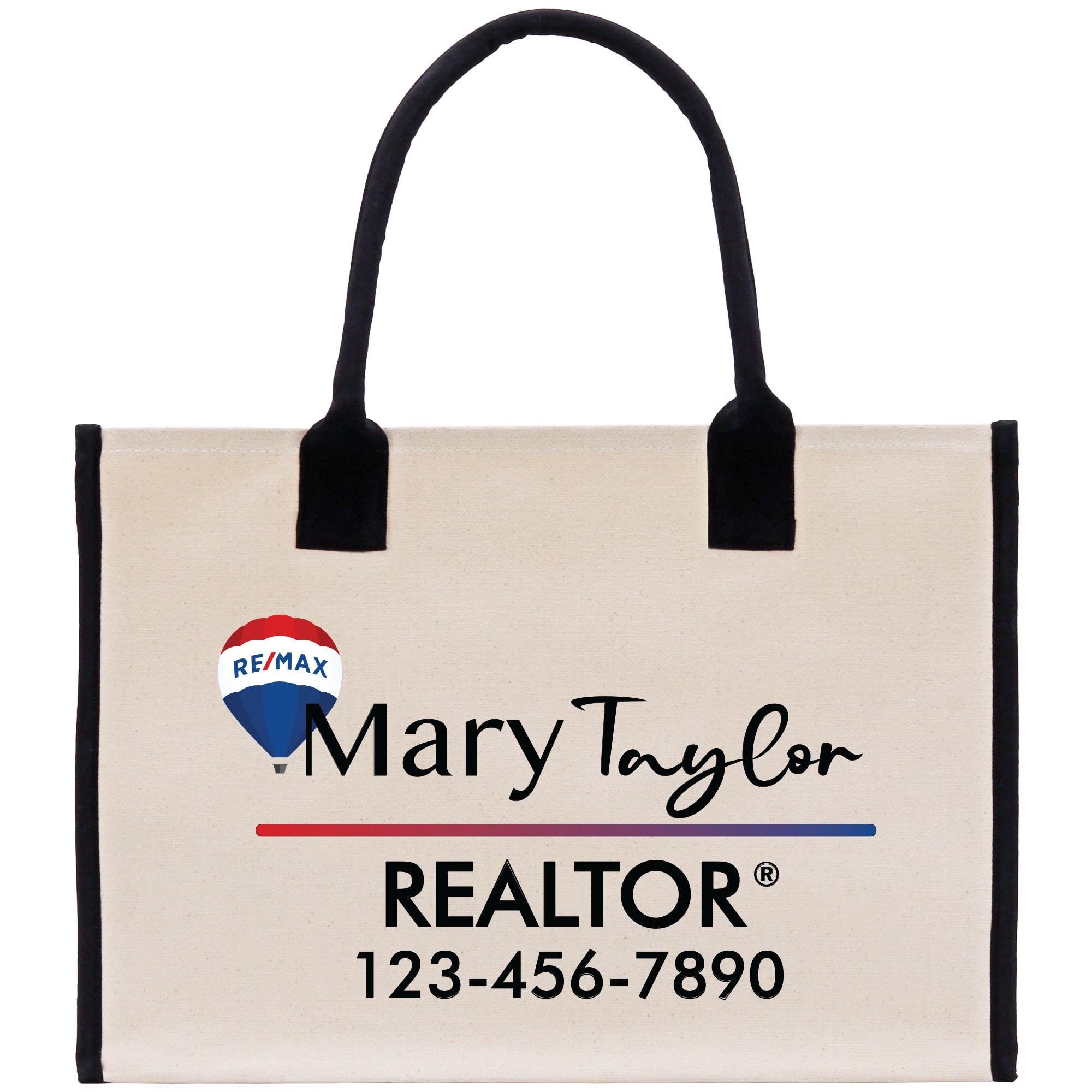 a white bag with a black handle and a red, white, and blue logo