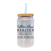 a white mason jar with a straw in it