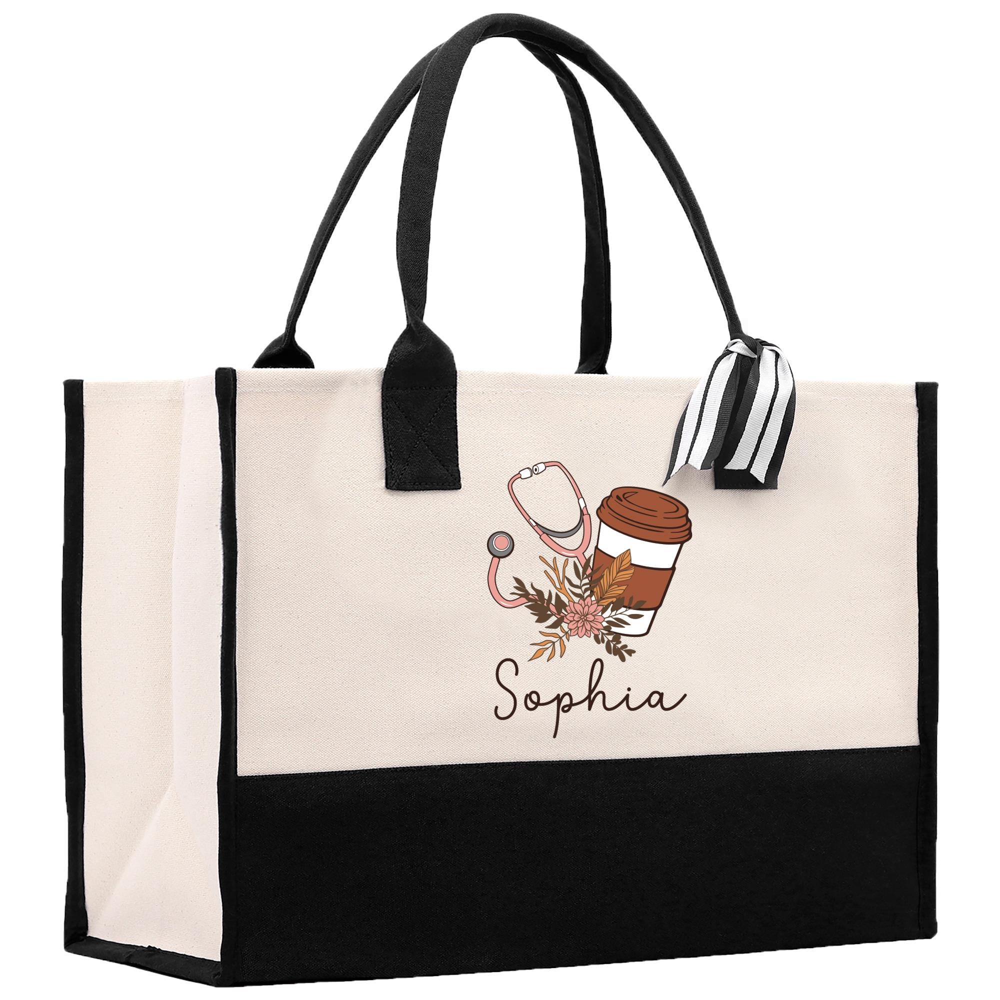 a black and white shopping bag with a cup of coffee on it