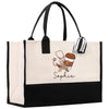 a black and white shopping bag with a cup of coffee on it