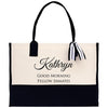 a black and white tote bag with a ribbon on it