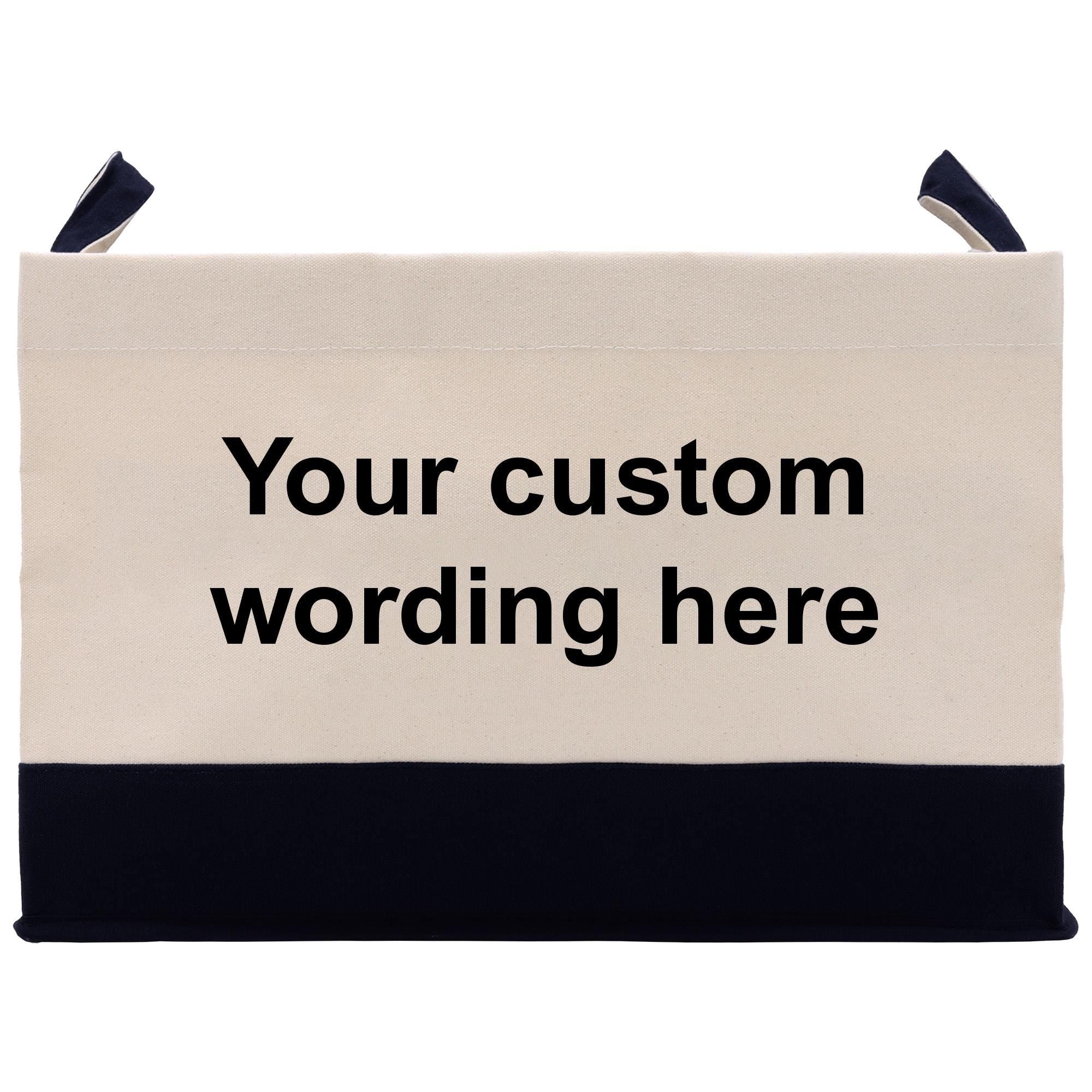 A beige canvas tote bag with a black trim, featuring the text &quot;Your custom wording here&quot; printed on it.