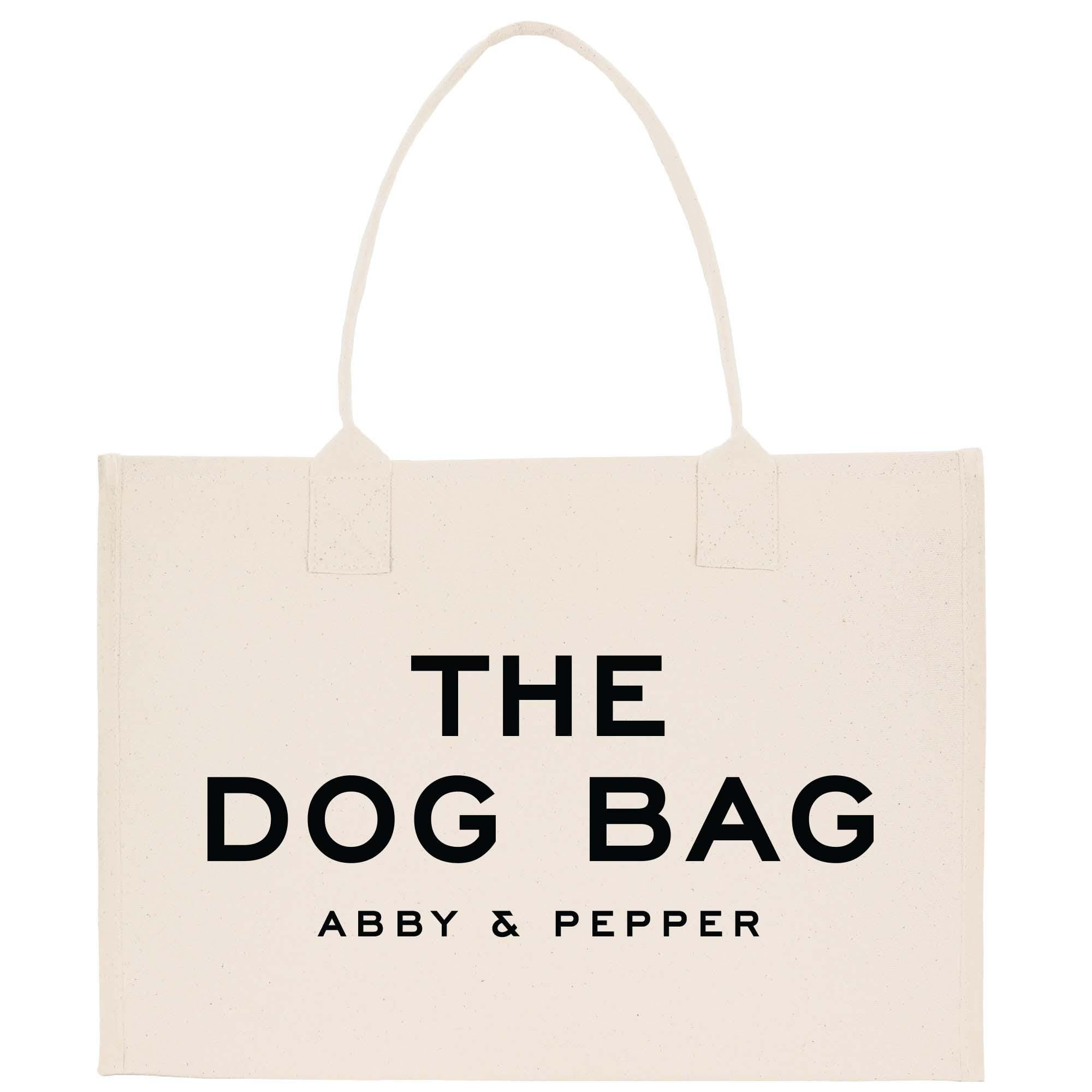 a white bag with the words the dog bag on it