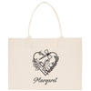 a white bag with a heart and the words margaret on it