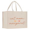 a white bag with a cat mom slogan on it
