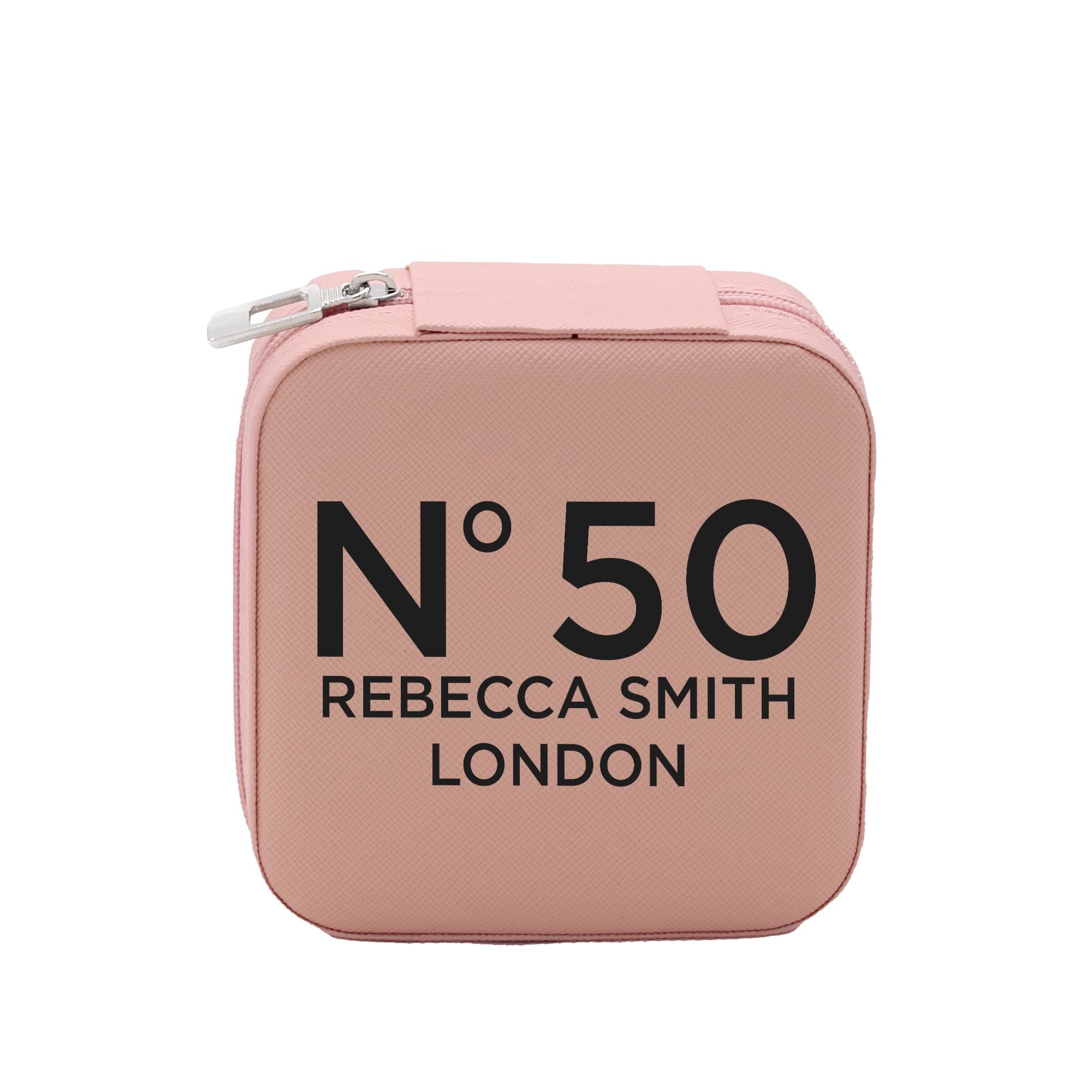 A pink makeup case with the text &quot;N50 Rebecca Smith London&quot; printed on it.