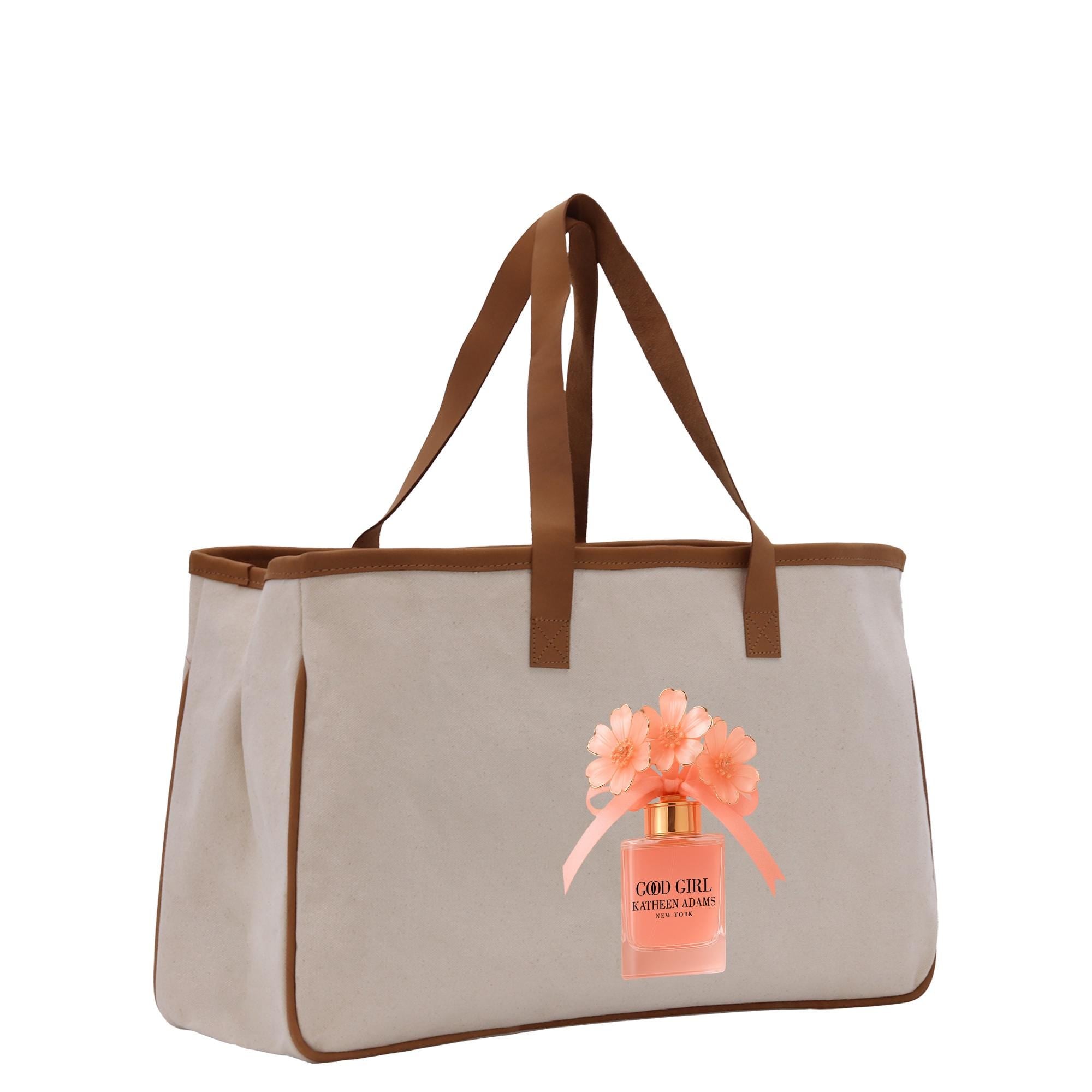 A tan tote bag with a brown handle and strap, featuring a printed image of a perfume bottle with orange flowers.