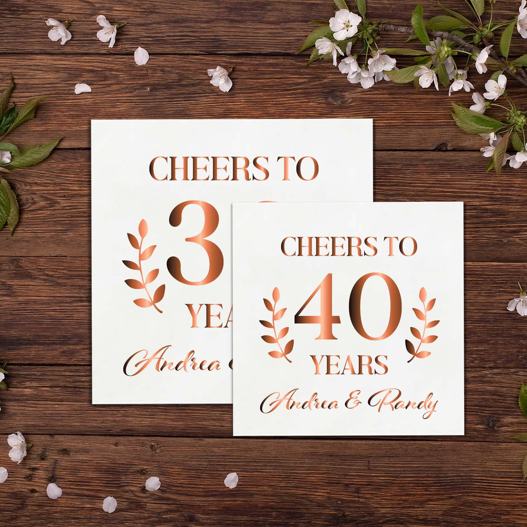 two cheers to thirty years cards on top of a wooden table