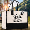 A black and white tote bag with the text 