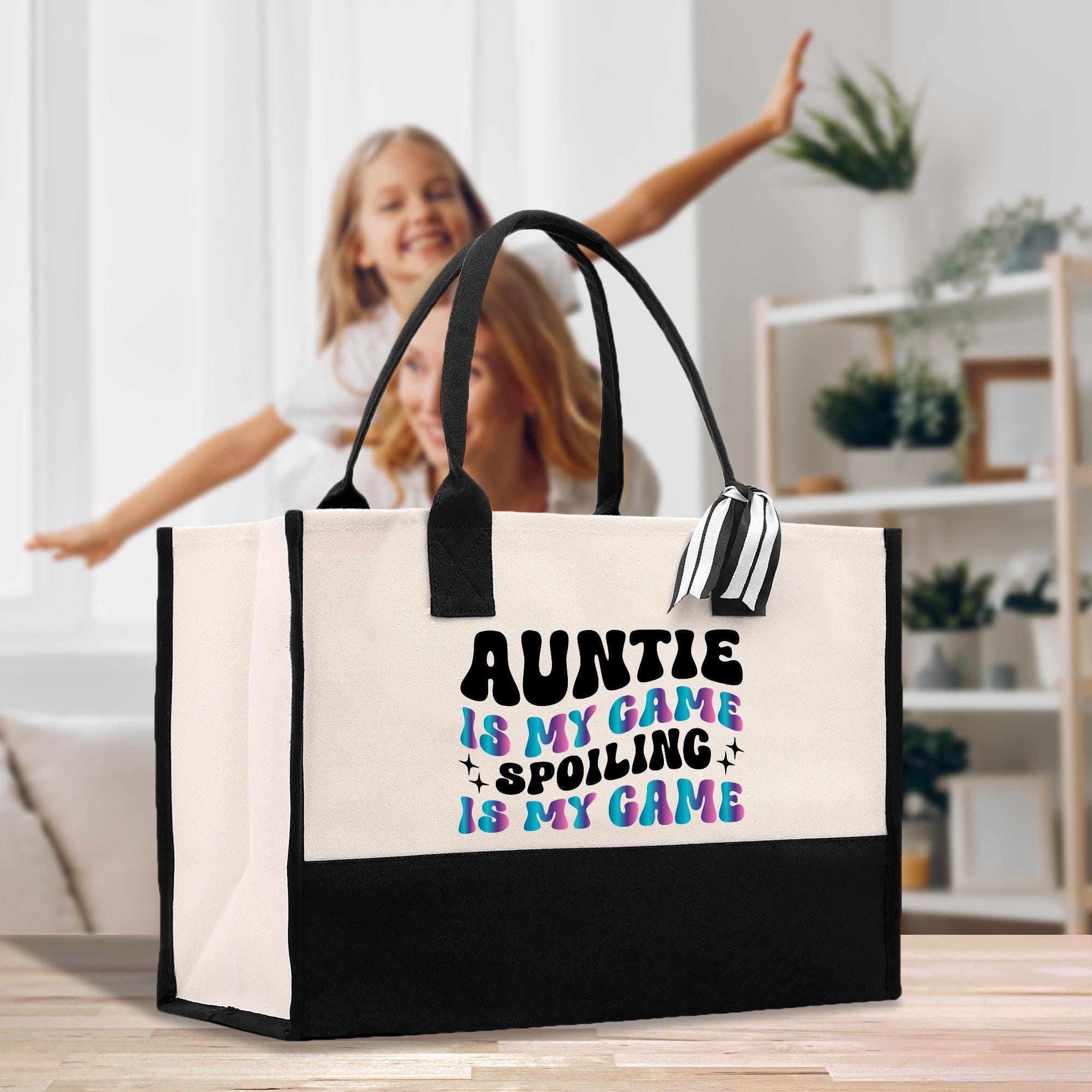 a woman holding a black and white shopping bag