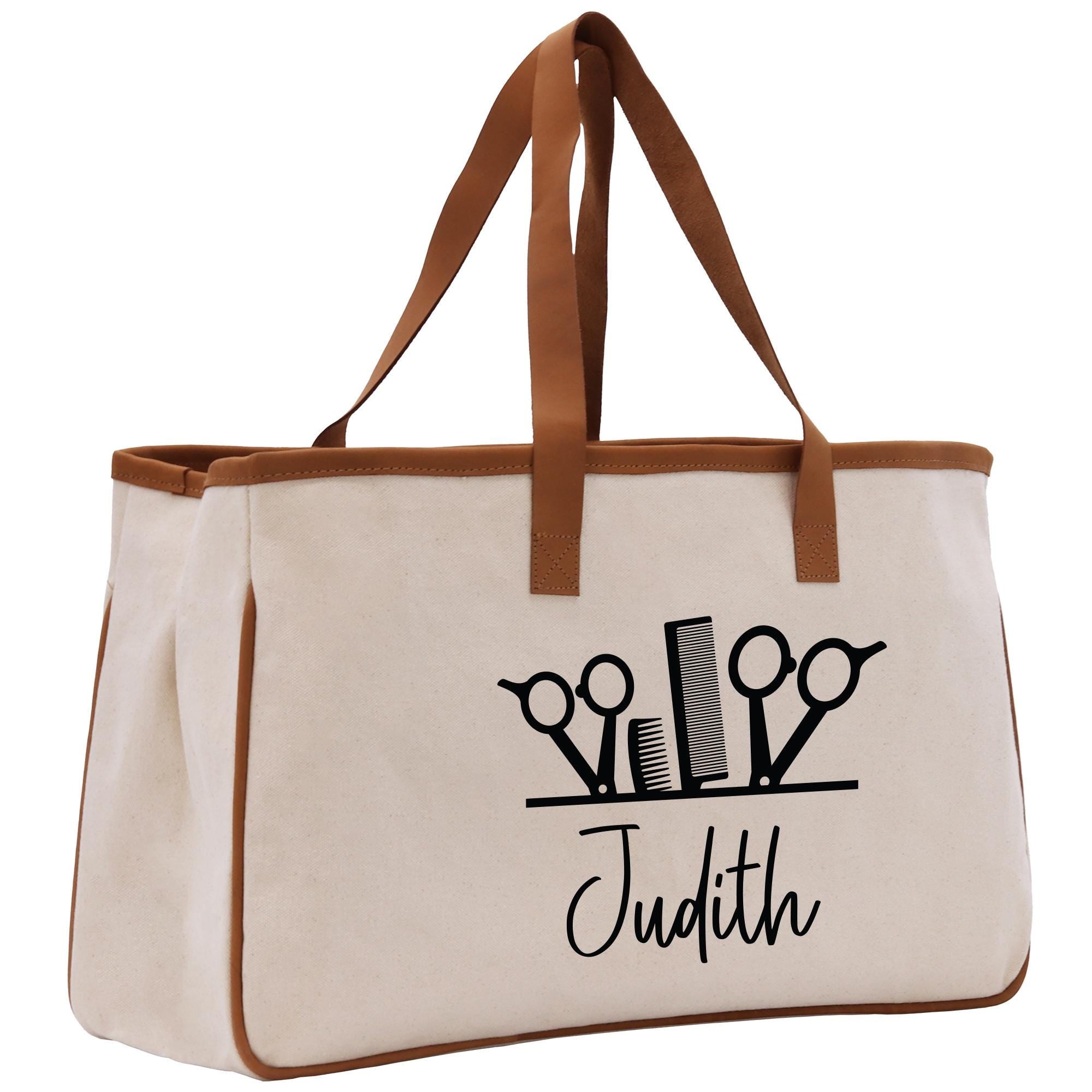 a tote bag with scissors and a name on it