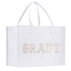 A white tote bag with the word "BRAUT" printed on it in large letters.