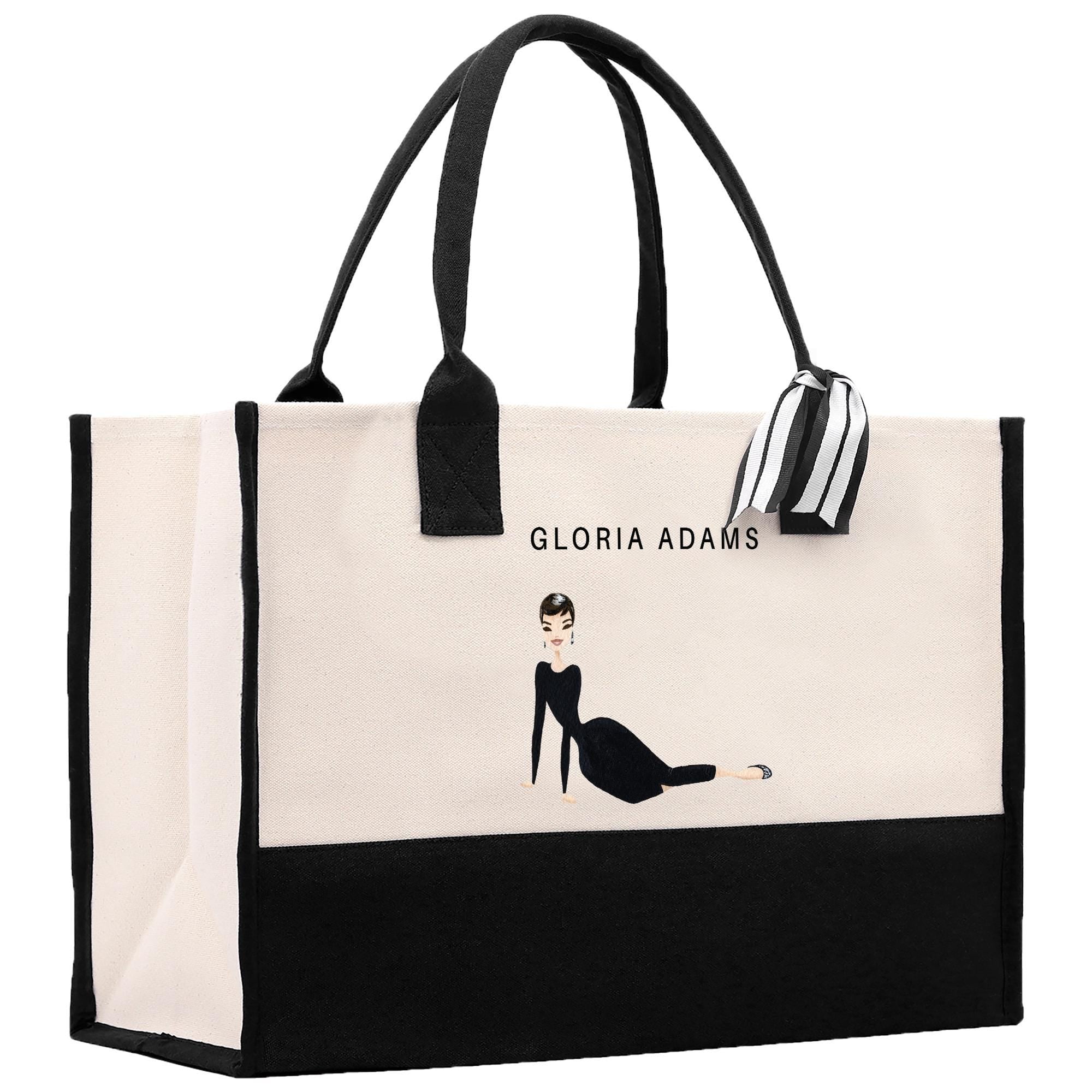 a black and white shopping bag with a picture of a woman
