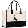 a black and white shopping bag with a picture of a woman
