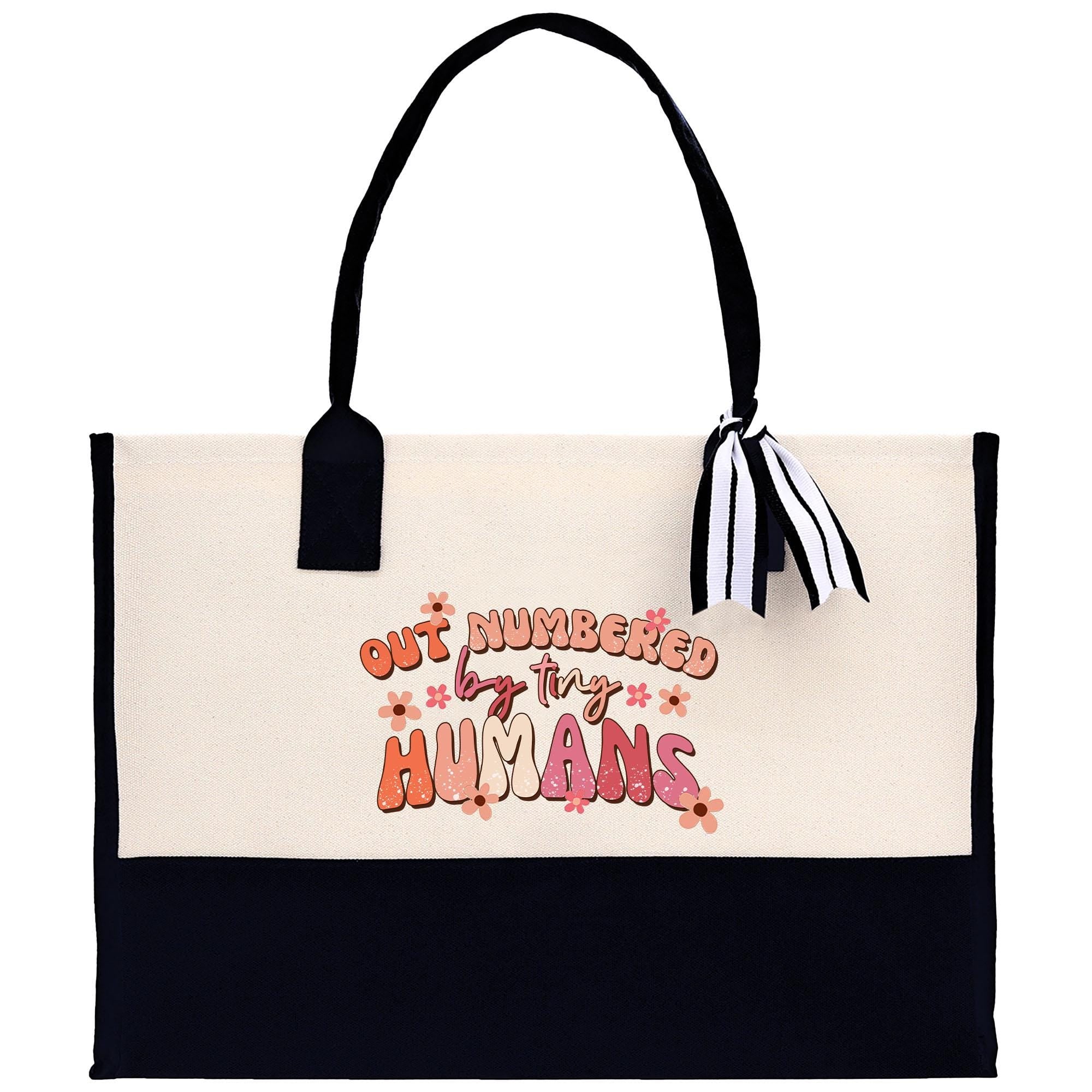 a white and black bag with a black handle