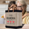 a woman and a child are looking at a bag