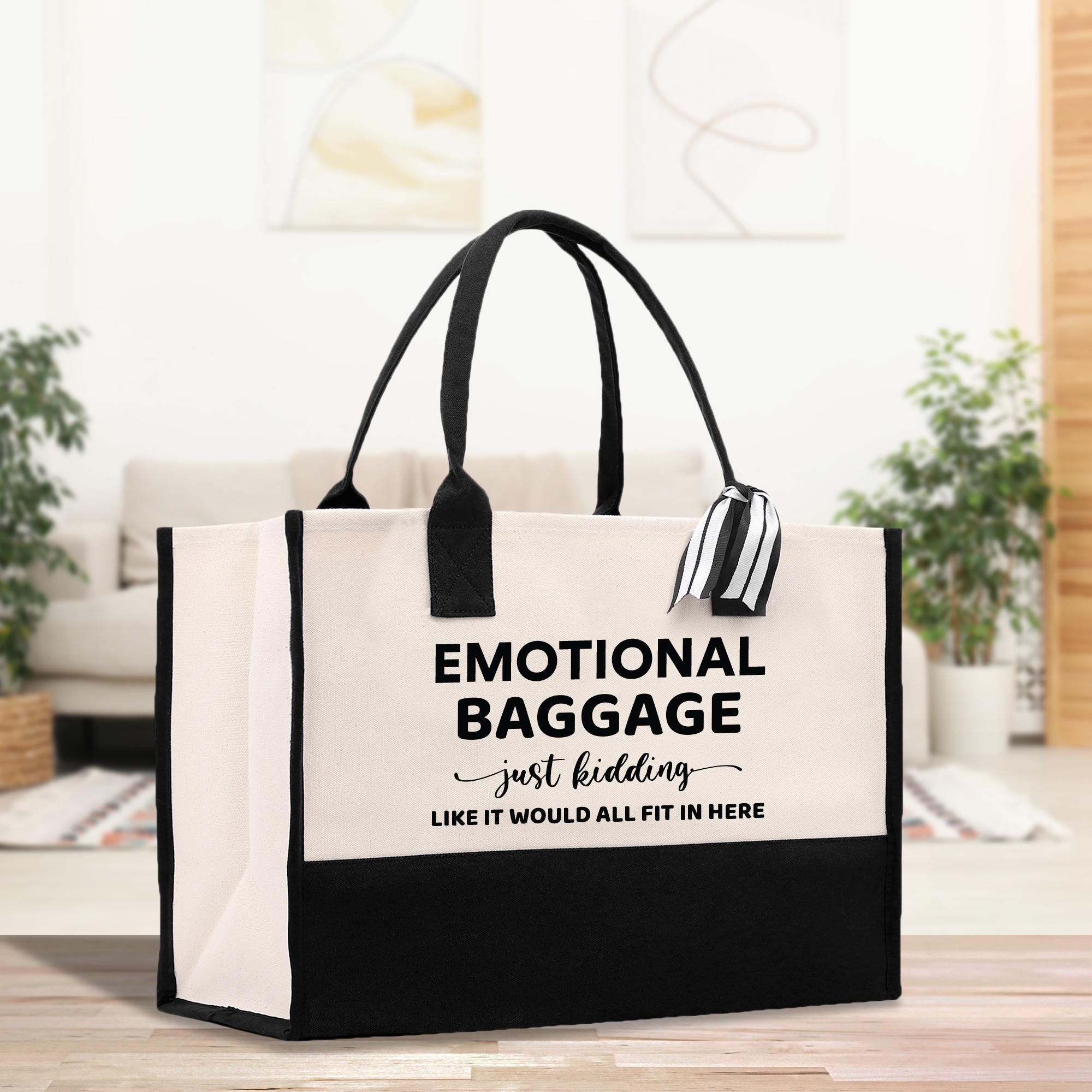 a black and white bag sitting on top of a wooden table