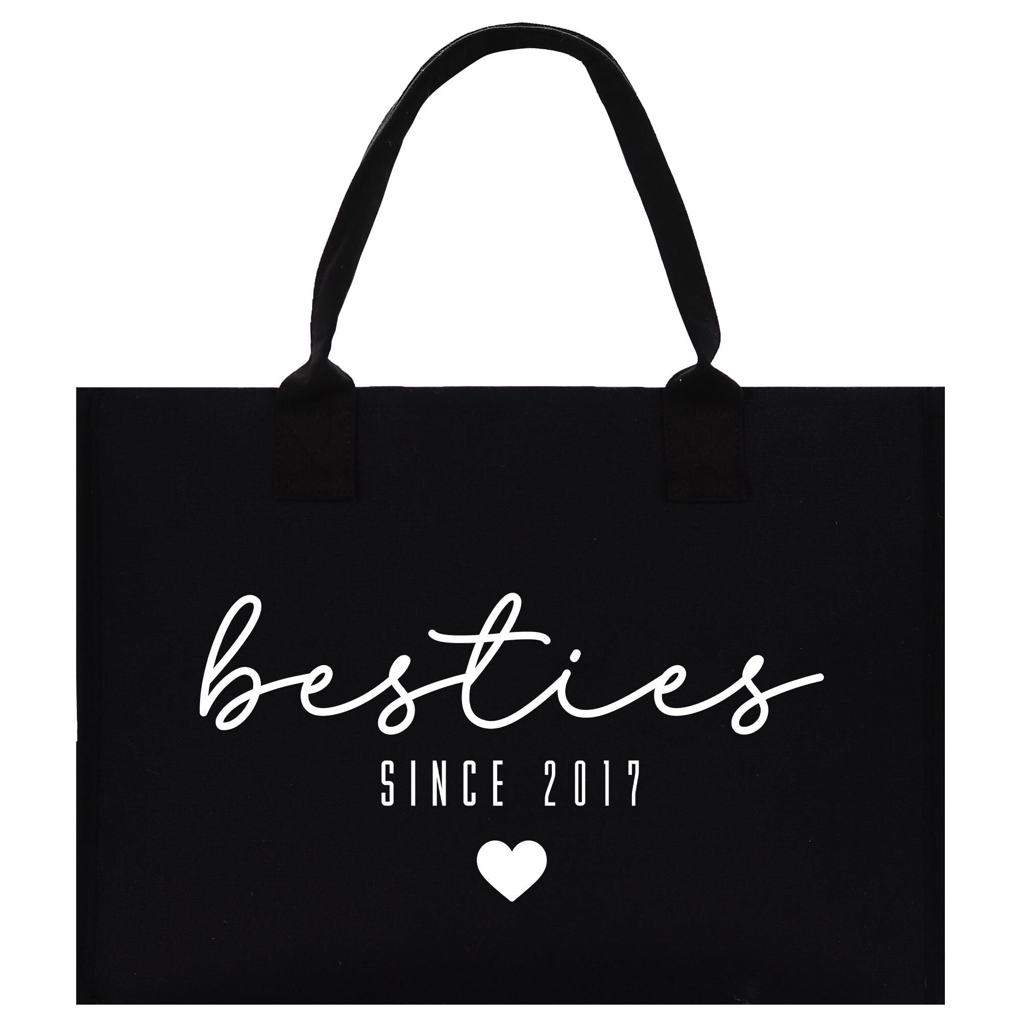 A black shopping bag with white text and a heart symbol.