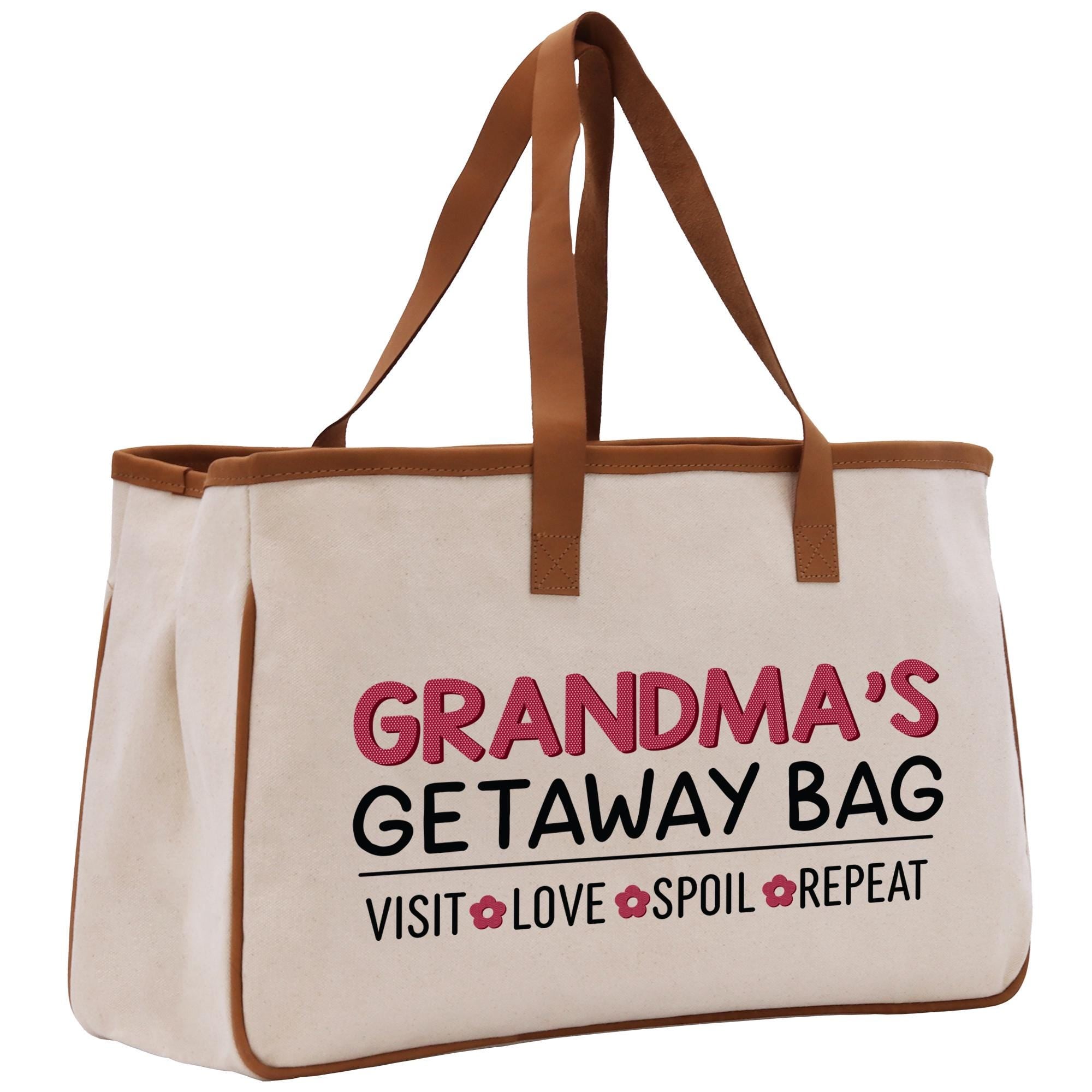 a white bag with a brown leather handle