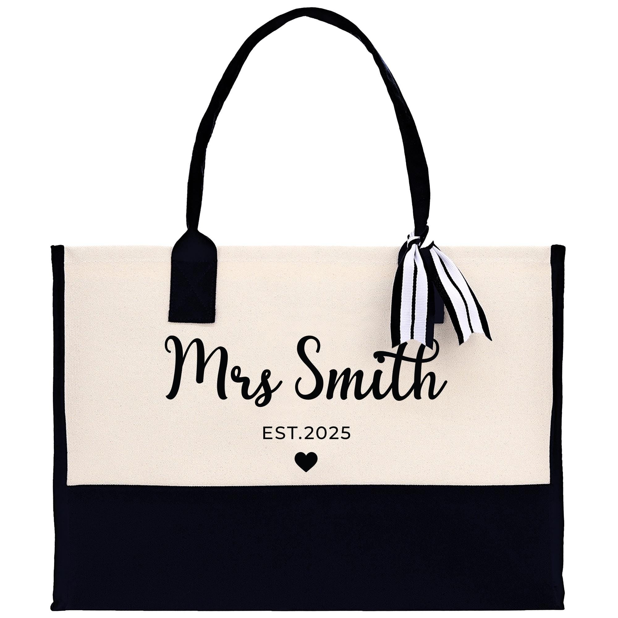 a black and white bag with a black and white ribbon